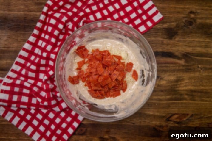 Cheesy Pepperoni Poppers 15 shredded cheese and diced pepperoni added to batter.