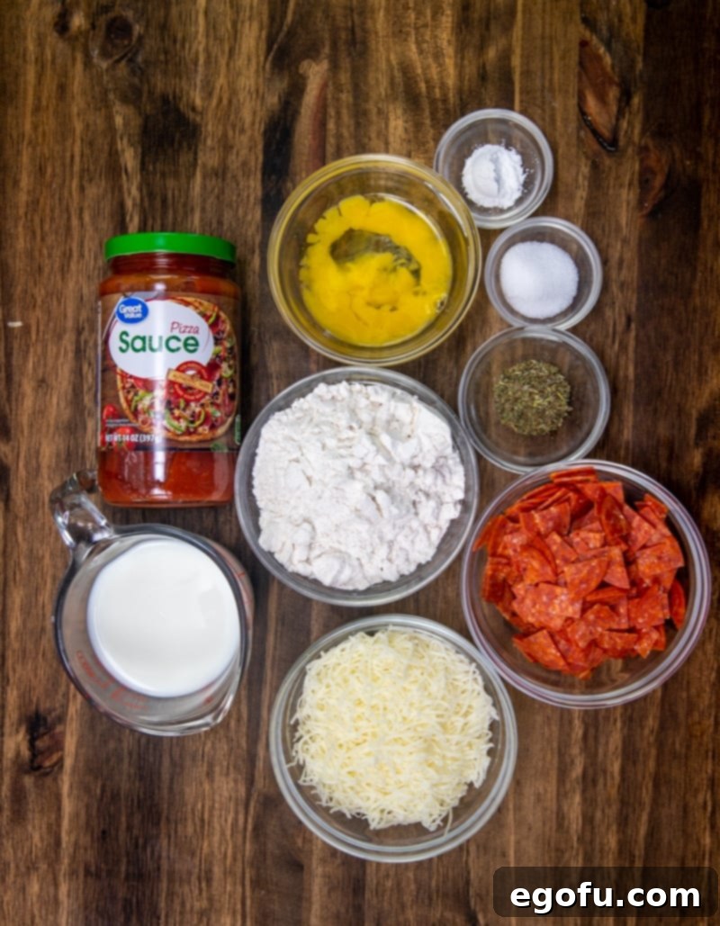 Cheesy Pepperoni Poppers 4 ingredients for Pepperoni Pizza Puffs: all-purpose flour, baking powder, Italian Seasoning, salt, milk, egg ,shredded mozzarella cheese, pepperoni, pizza sauce.