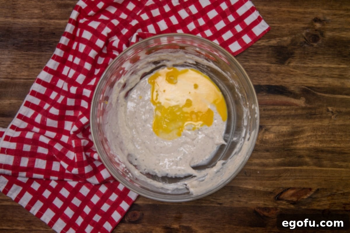 Cheesy Pepperoni Poppers 7 eggs added to batter in the bowl.