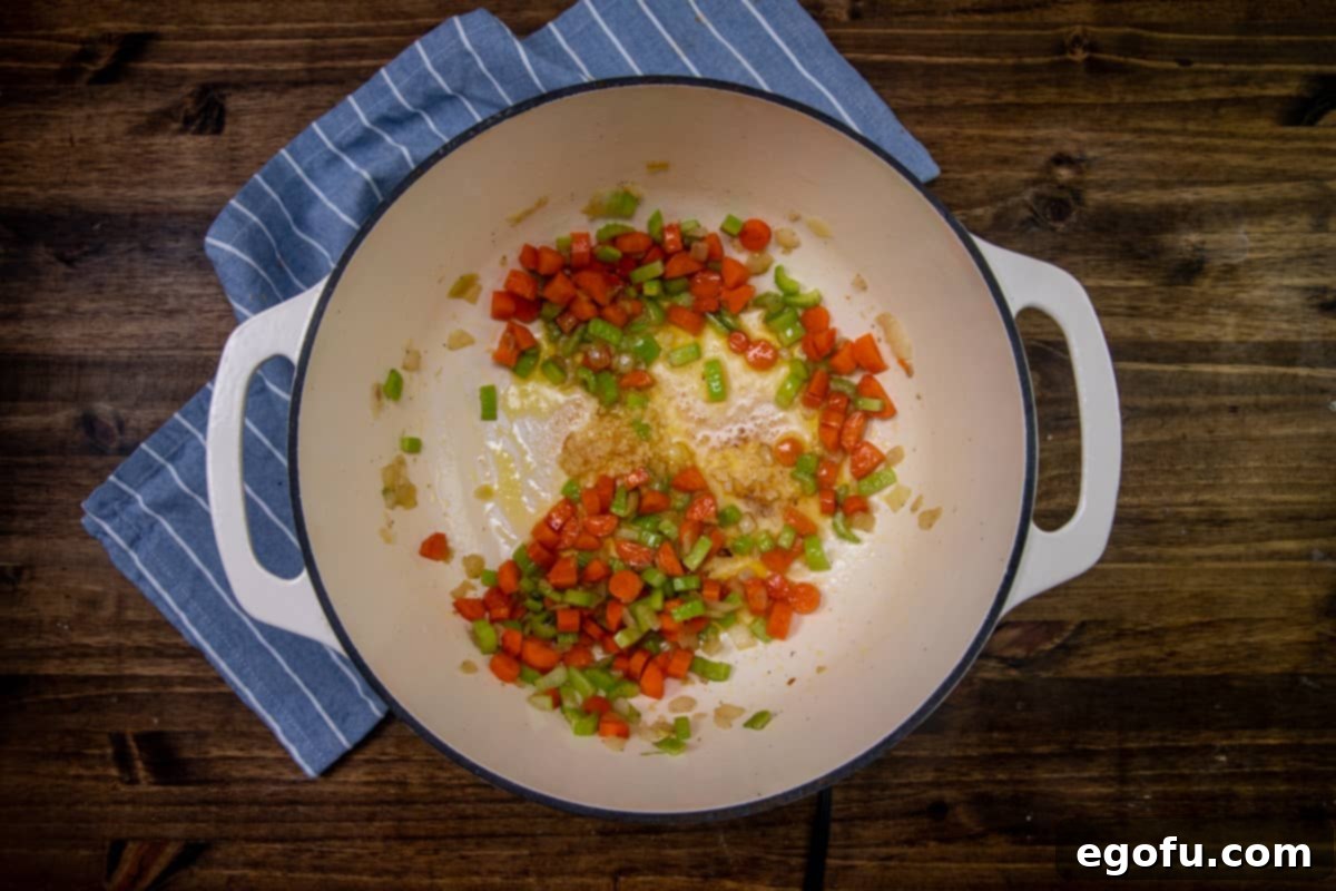 Diced celery, carrots, olive oil, onions, and garlic sautéed in a large stock pot