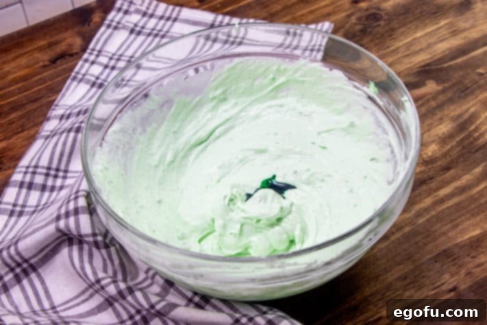 Green food coloring added to whipped topping.