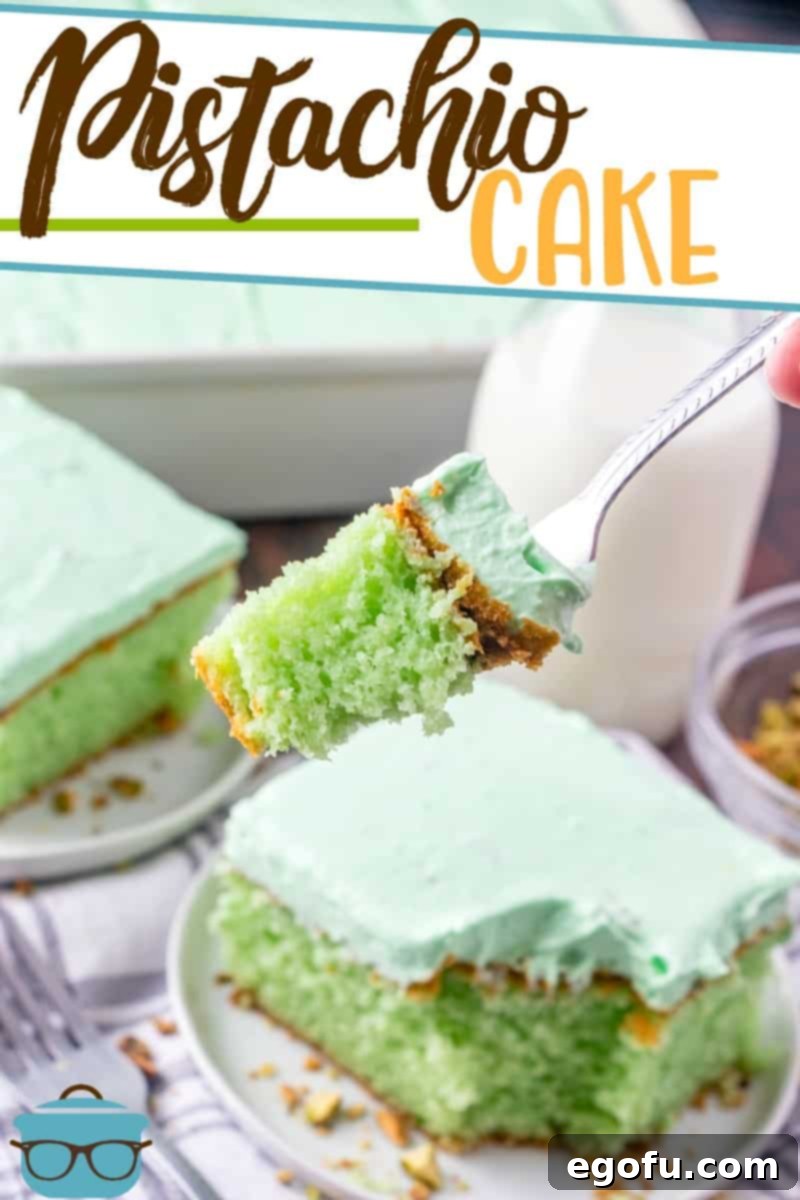 A fork holding up a serving of Pistachio Cake.