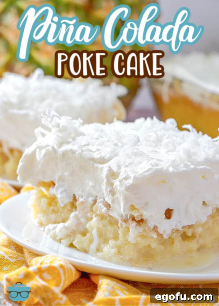 Piña Colada Paradise Poke Cake 4 Close up side photo of a slice of pineapple coconut cake on a small round white plate, showing the layers of cake, infused glaze, crushed pineapple, whipped topping, and shredded coconut.