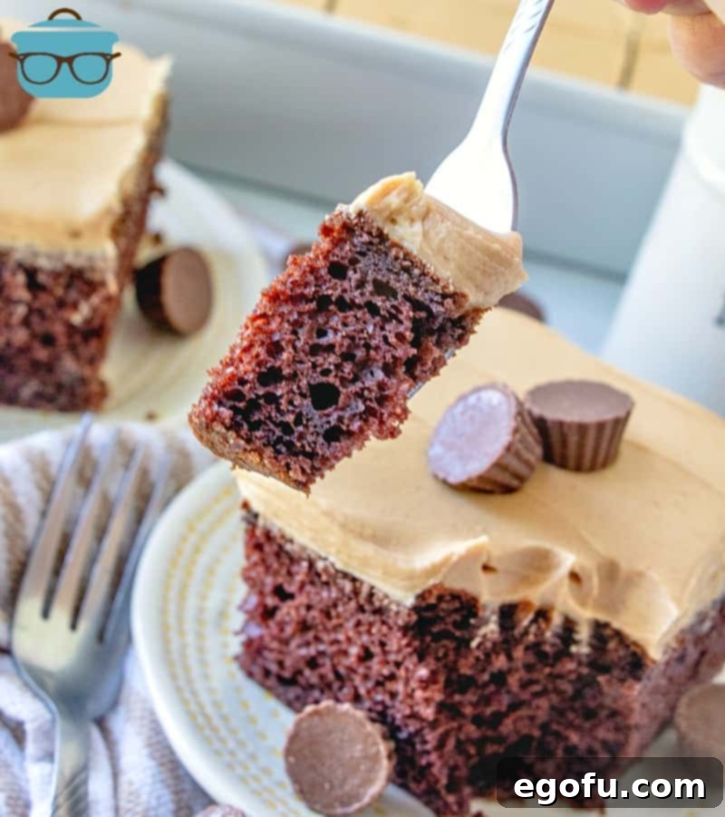 a fork holding up a piece of Reese's Peanut butter Cake.