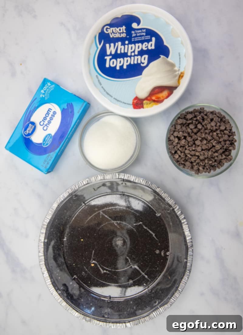 OREO pie crust, cream cheese, whipped topping, sugar, mini chocolate chips and chocolate syrup.