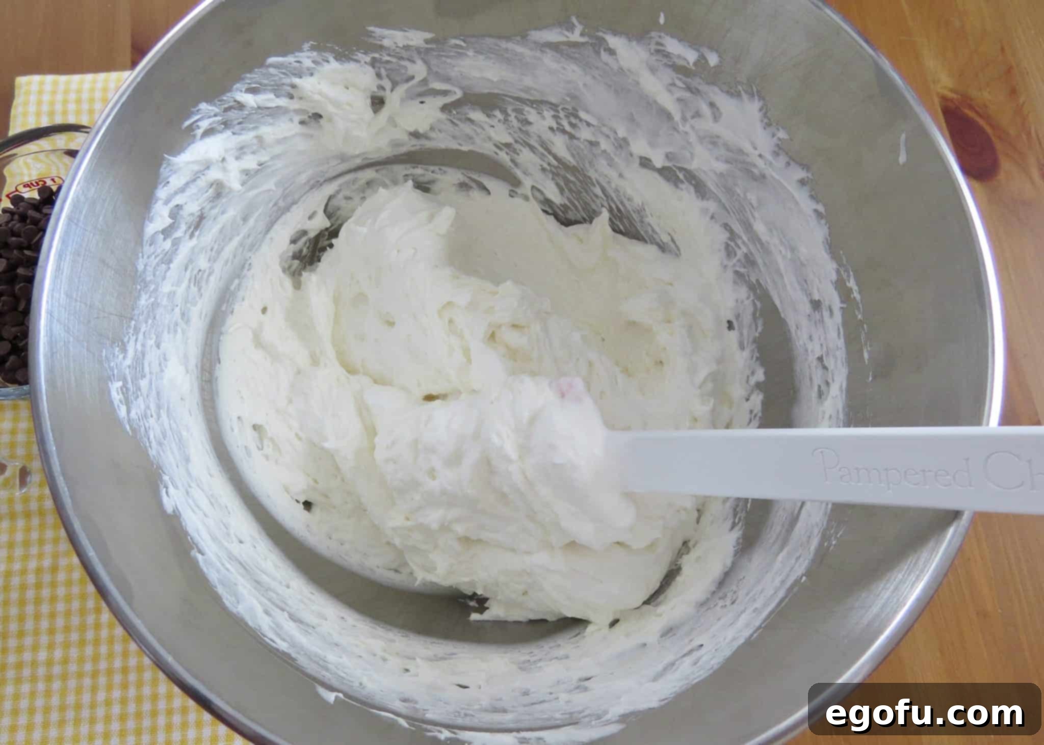 gently folding in Cool Whip to cream cheese mixture.