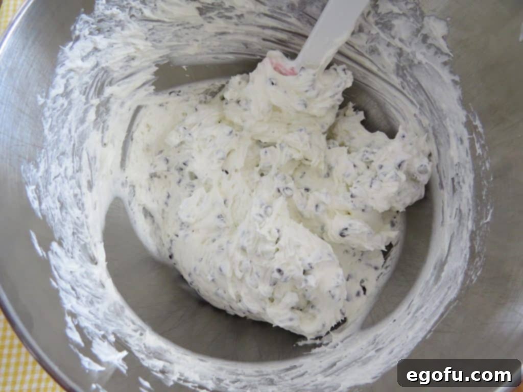 finished, chocolate chip cheesecake mixture in a mixing bowl