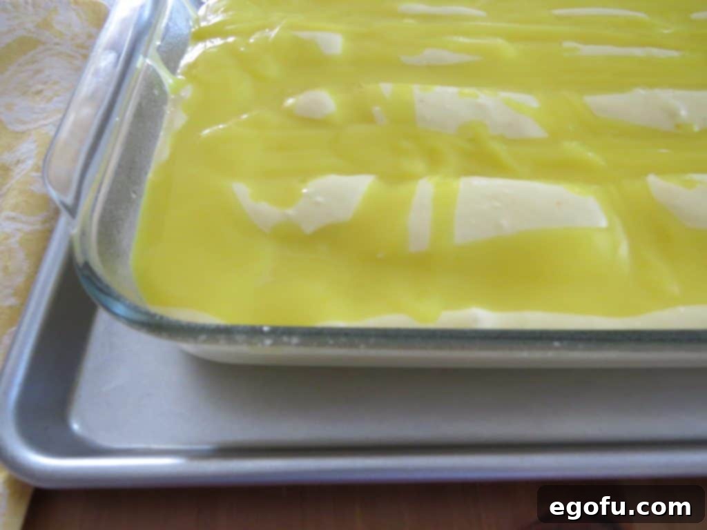 Lemon Lava Cake batter in a 9x13 glass baking dish, ready for the oven
