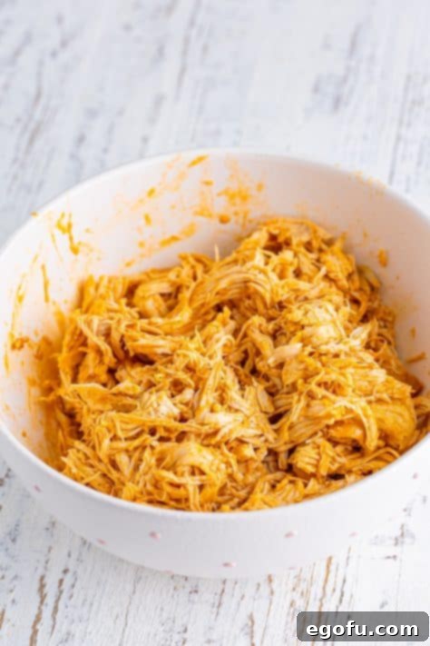 A bowl of shredded Buffalo Chicken.