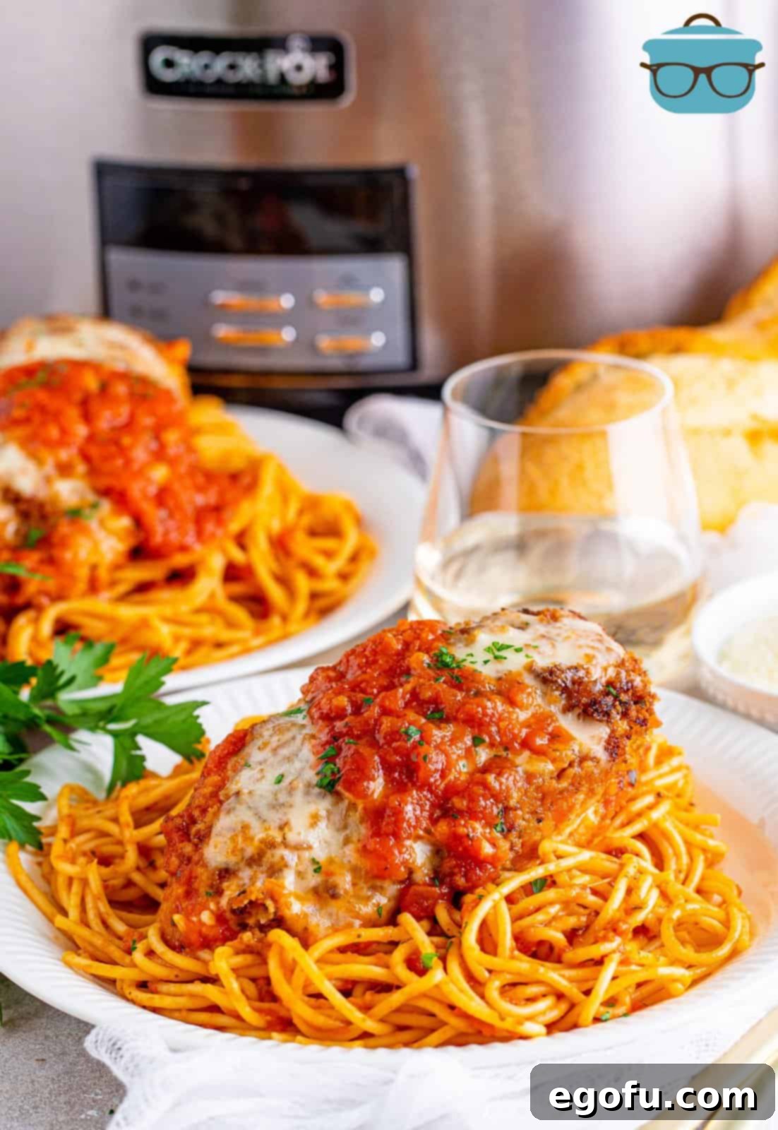 Slow Cooker Chicken Parm Perfection 2 Delicious Crock Pot Chicken Parmesan ready to serve, showing the golden-brown breading, rich marinara, and melted mozzarella cheese.