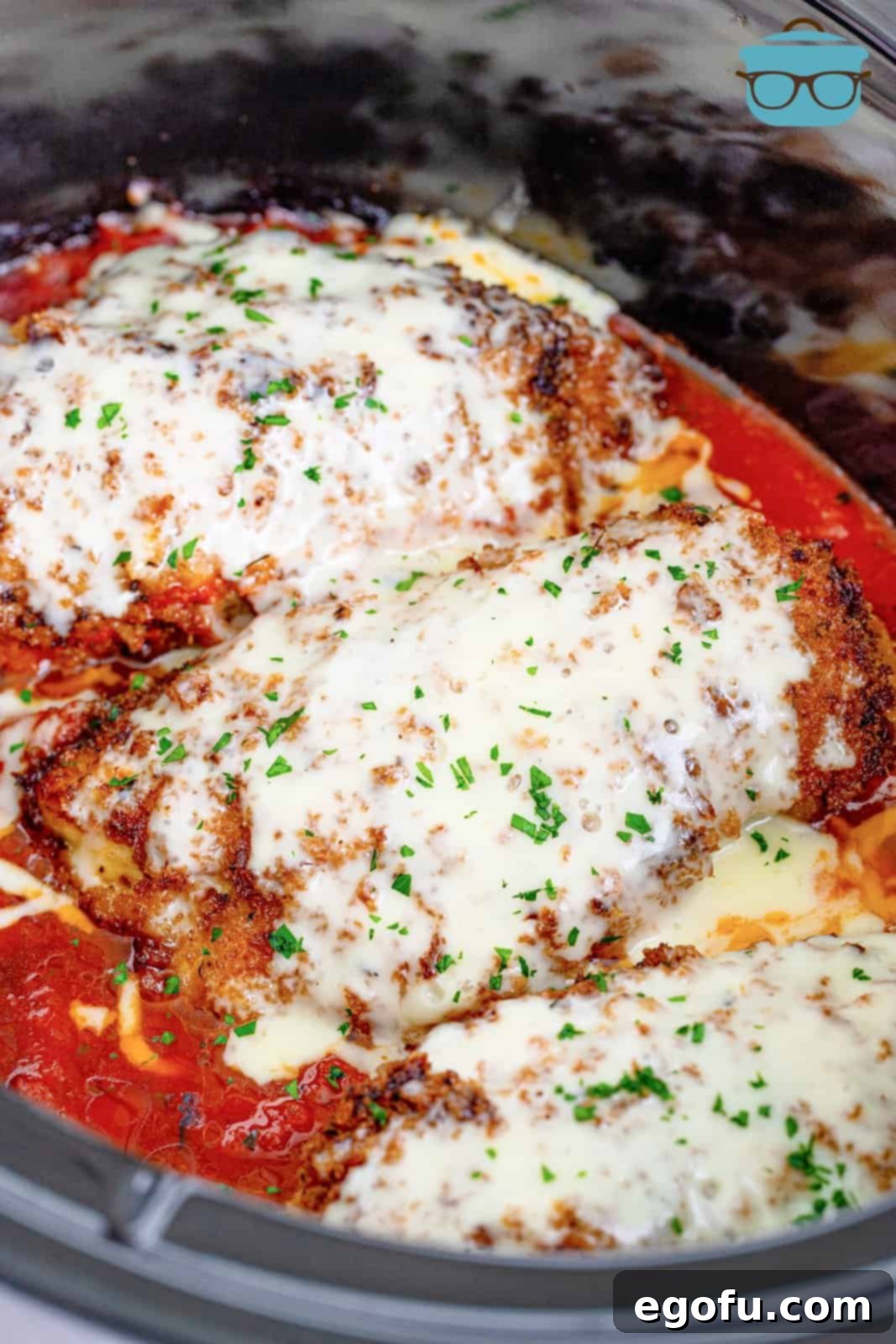 Slow Cooker Chicken Parm Perfection 14 Fully cooked chicken parmesan in the slow cooker with perfectly melted, bubbling cheese on top.