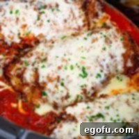 Slow Cooker Chicken Parm Perfection 16 Slow Cooker Chicken Parmesan recipe thumbnail, showcasing the finished dish with melted cheese and sauce.