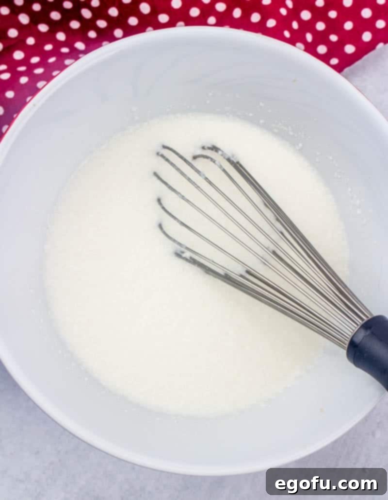 Ruby Snowdrift Cake 7 Prepared white chocolate pudding sitting in a bowl, perfectly smooth and ready to be used.