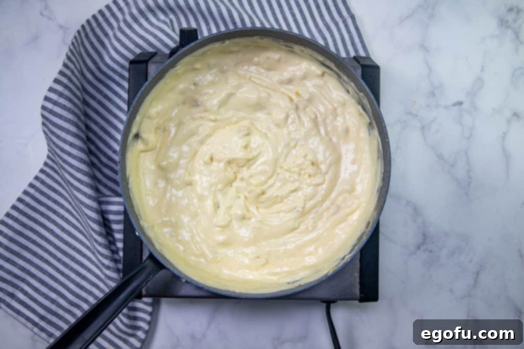 cream cheese, onion and garlic mixture stirred until smooth in a large skillet.
