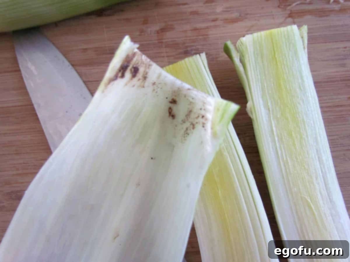 photo of dirt hiding inside the layers of leeks.