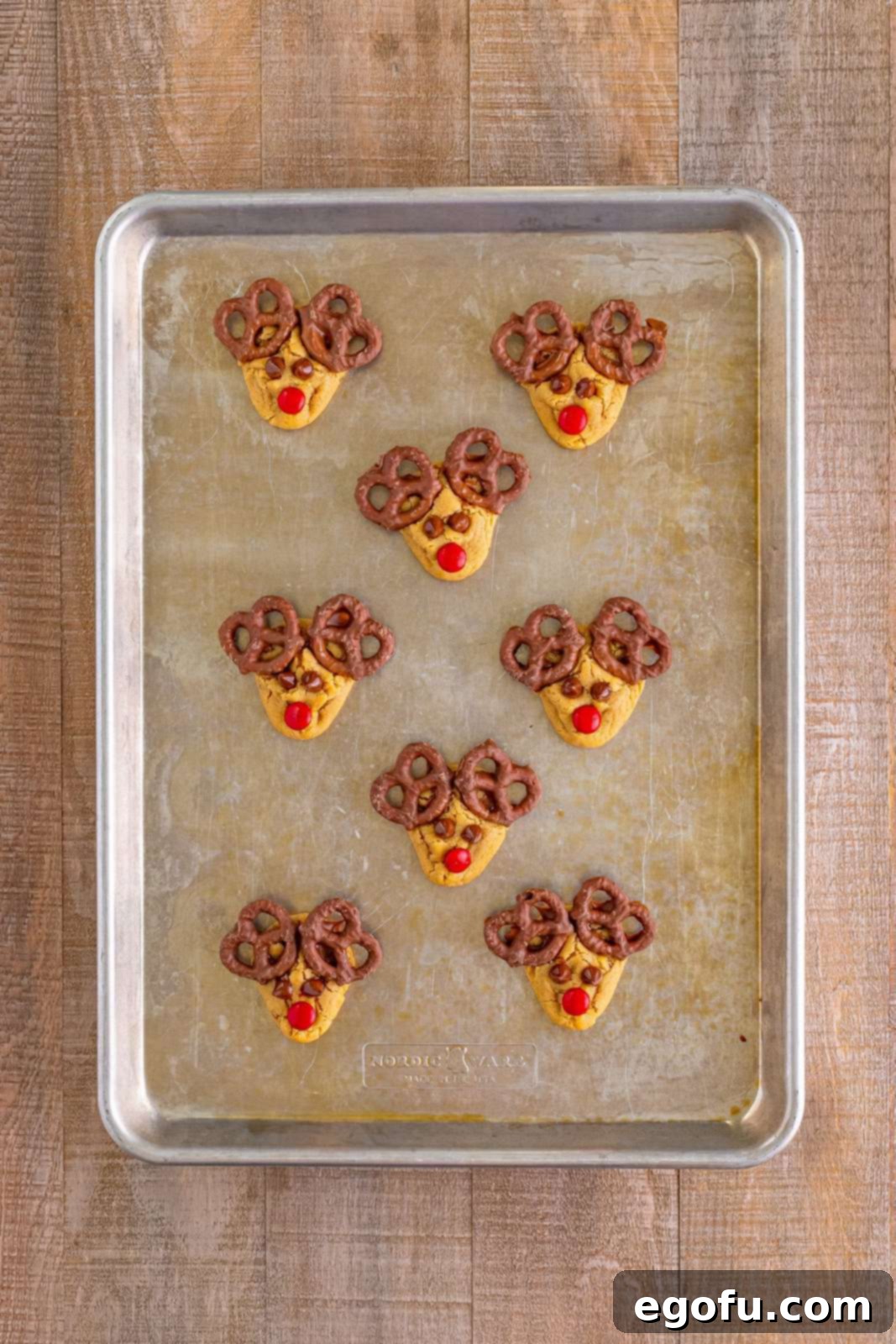 Red Nosed Reindeer Treats 13 chocolate covered pretzels added to the tops of the cookies to make the antlers.