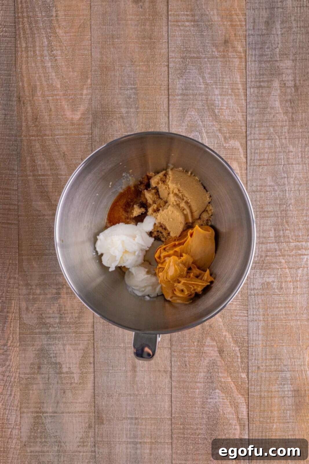 Red Nosed Reindeer Treats 5 brown sugar, peanut butter, shortening, milk and vanilla extract in the bottom of a mixing bowl.