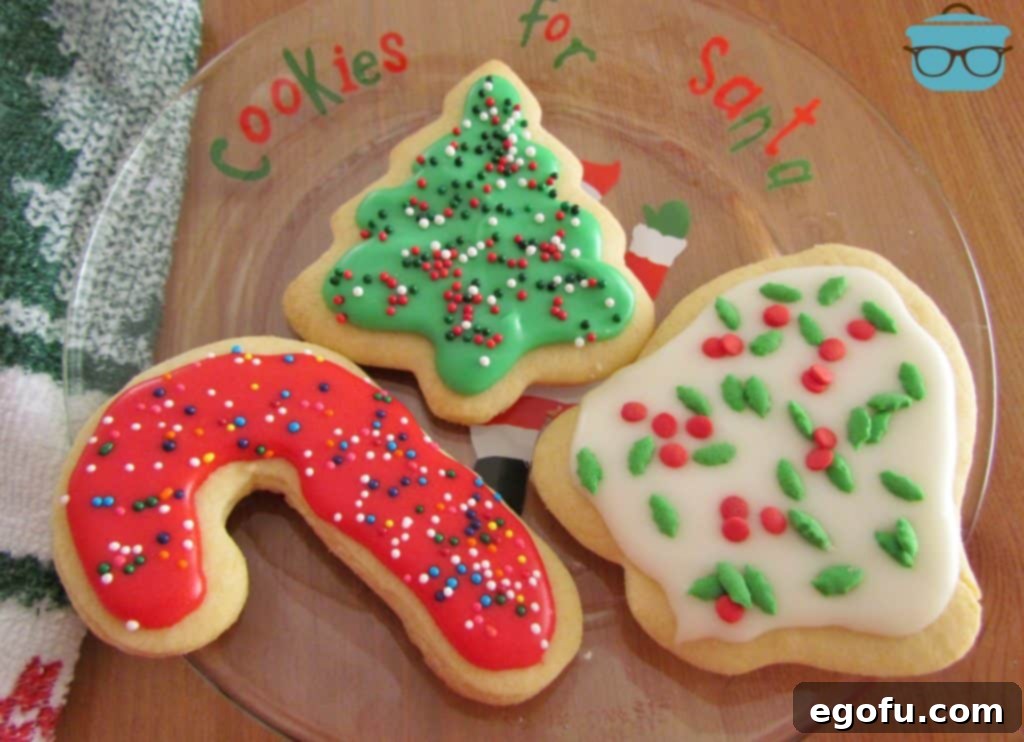 Cut Out Christmas Decorated Sugar Cookies on a clear 'Cookies for Santa' Plate
