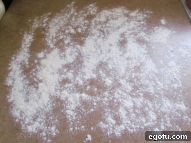 flour shown scattered on a counter surface