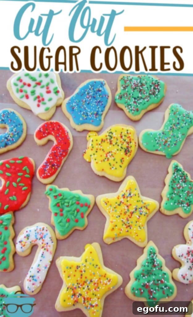 Cut-Out Sugar Cookies recipe from The Country Cook - colorful decorated sugar cookies shown on a large sheet of wax paper