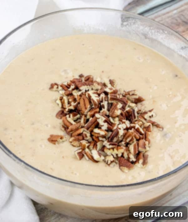 chopped pecans added to pecan praline cake batter