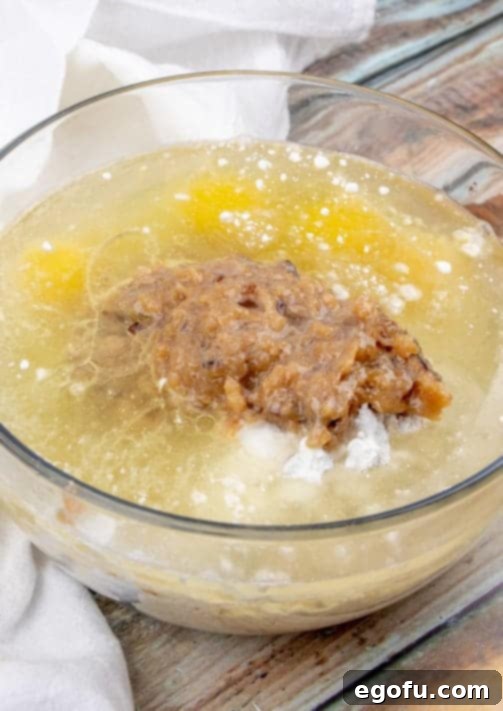 butter pecan cake mix, coconut pecan frosting, eggs, and oil in a large mixing bowl.