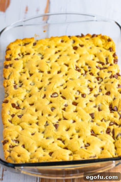 A baking dish with uncut Chocolate Chip Cookie Bars.