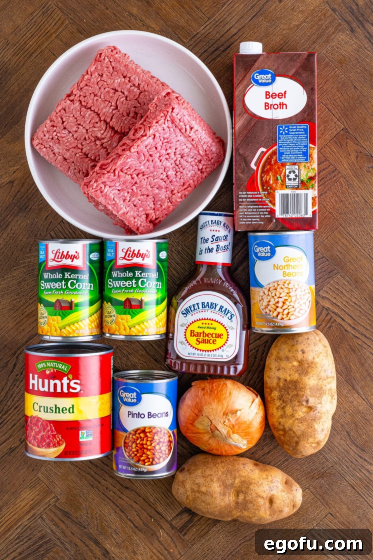 Ground beef, onion, potatoes, crushed tomatoes, bbq sauce, corn, pinto beans, northern beams and beef browh. 