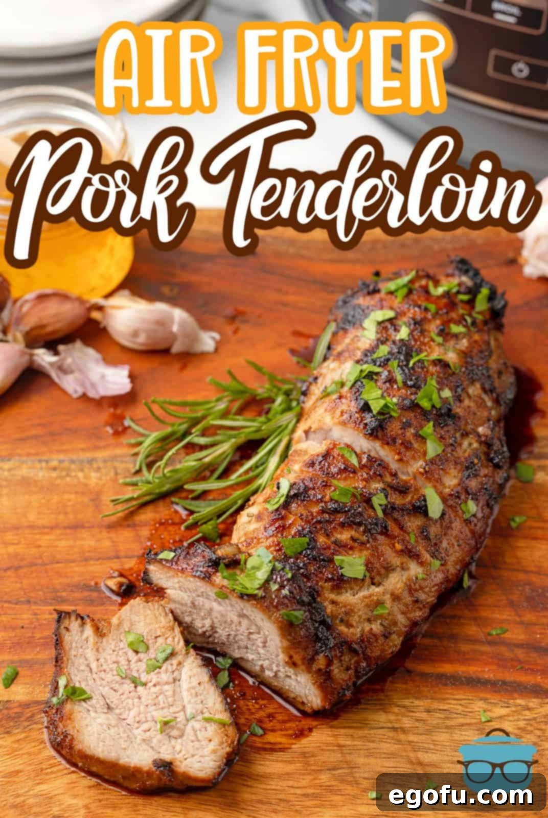 A beautifully presented Air Fryer Pork Tenderloin, with several juicy slices already cut, ready to be served.