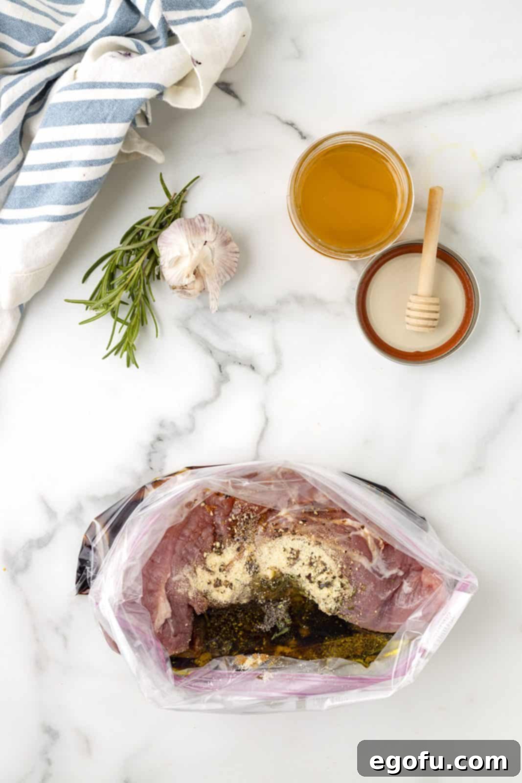 Remaining marinade ingredients being added to a bag with the pork tenderloin.