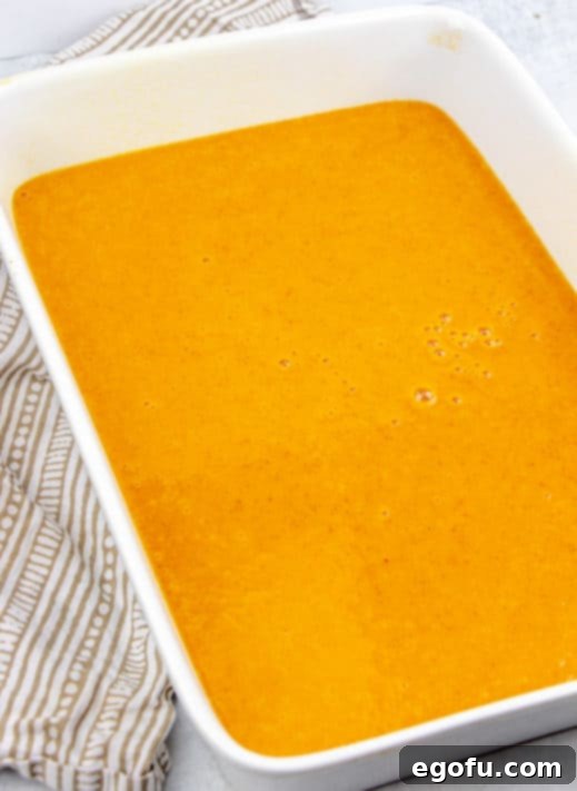 Pumpkin pie mix poured into a baking dish.