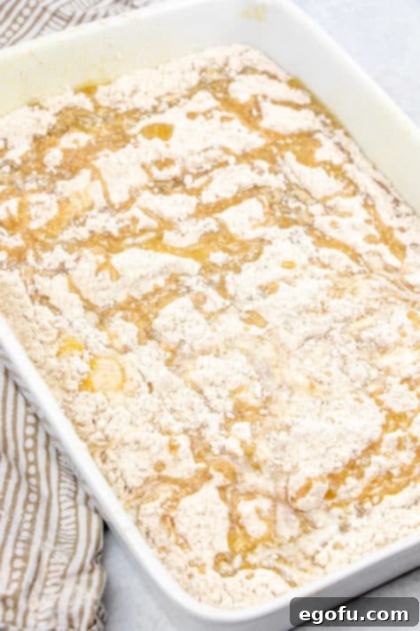 Melted butter drizzled over cake mix topping.