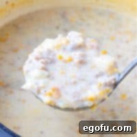 Easy Sausage Corn Chowder recipe, presented in a clean white bowl with a spoon