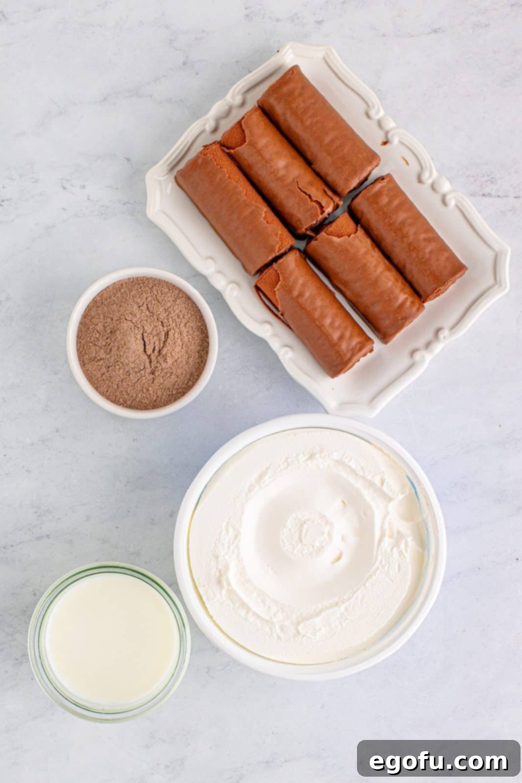 Easy No-Bake Swiss Roll 4 Ingredients needed: instant chocolate pudding mix, whole milk, cool whip and swiss cake rolls.