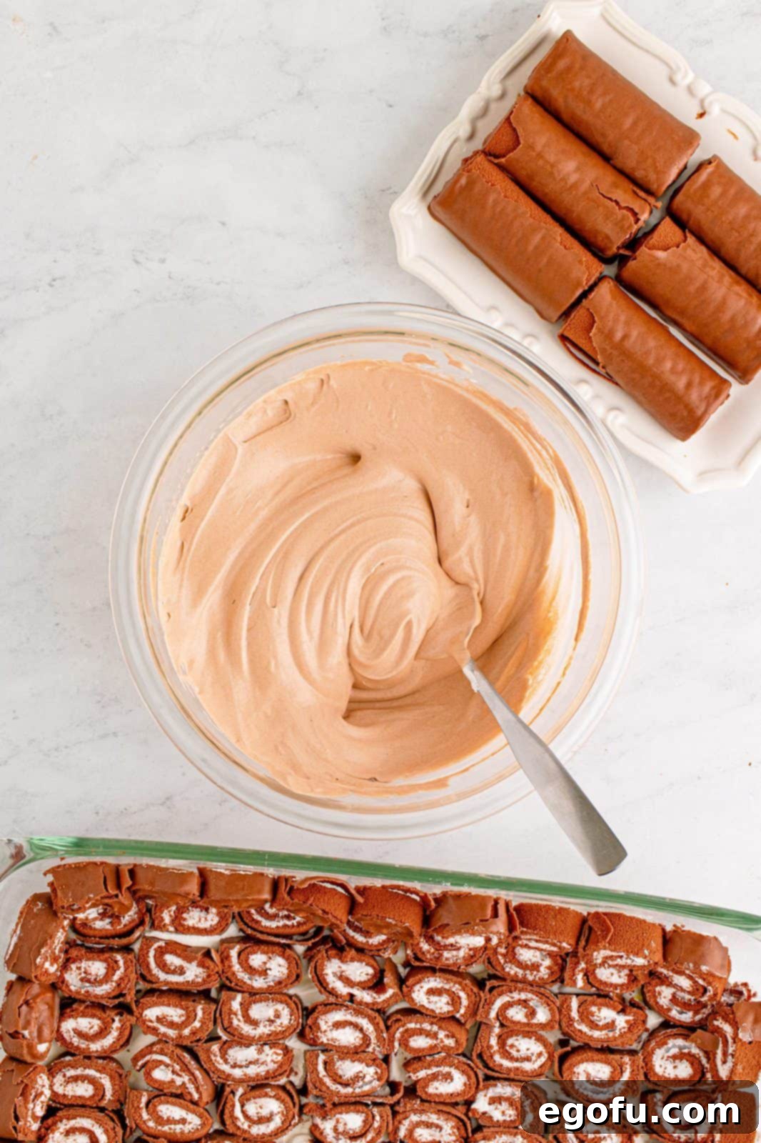 Easy No-Bake Swiss Roll 8 Cool whip mixed into some of the chocolate pudding in bowl.