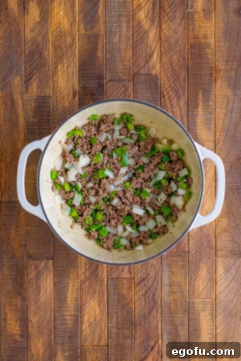 Excess grease drained from ground beef and put back into pot.