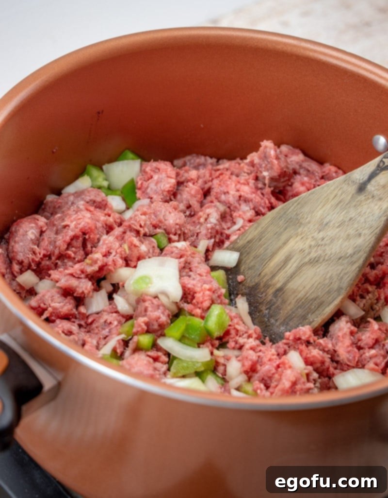 ground beef, green pepper, diced onions, salt and pepper in a large pot.
