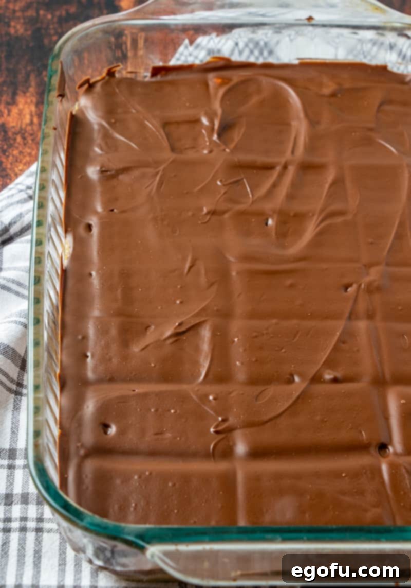 homemade Kit Kat Bars (before cutting) in a Pyrex baking dish after they have cooled.