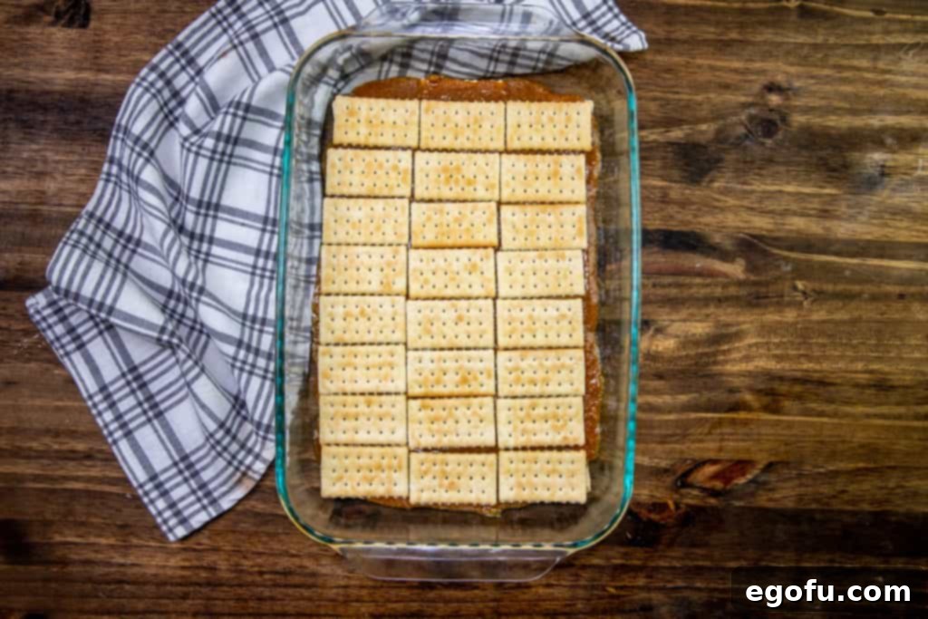 second layer of club crackers on top of graham cracker butter mixture in baking dish