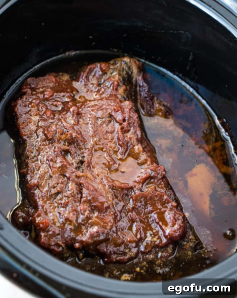 fully cooked bbq beef brisket in a crock pot