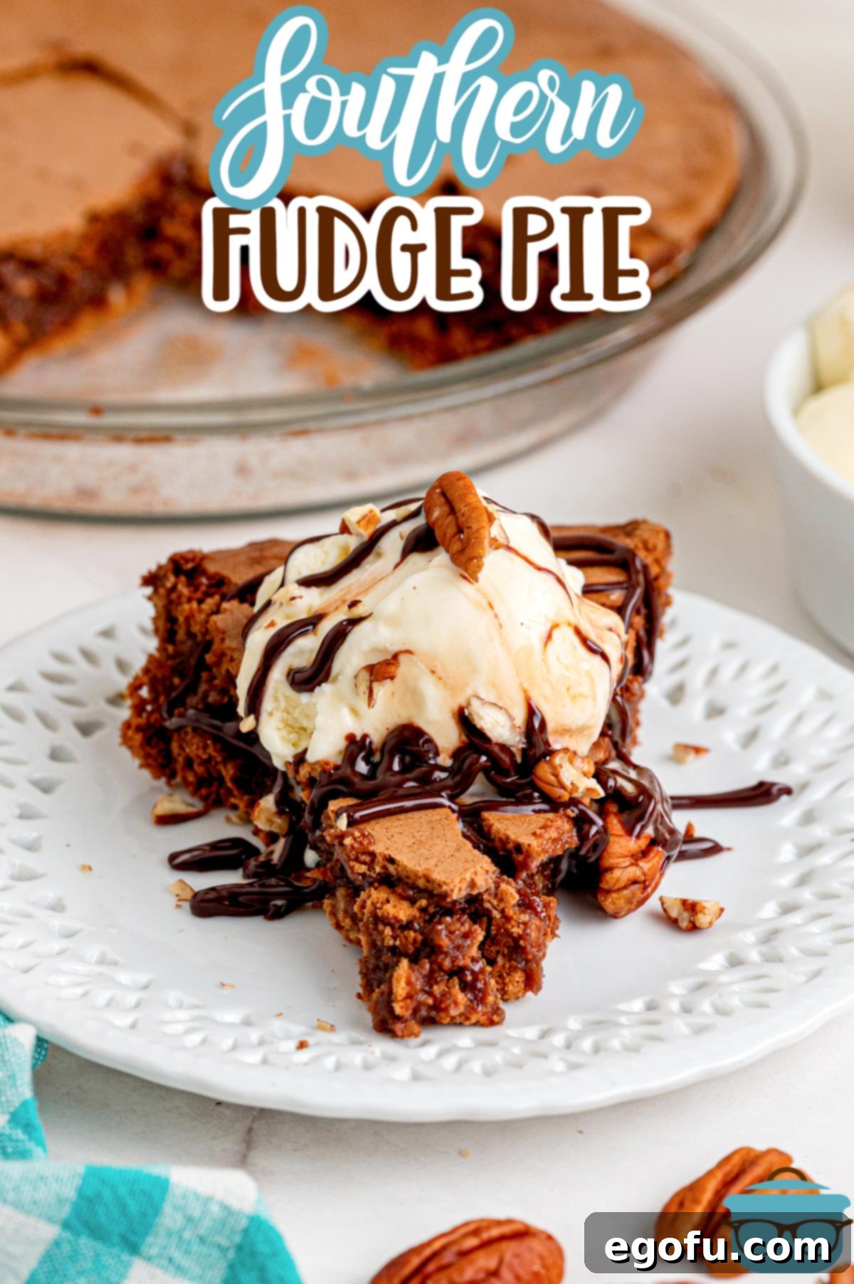 Rich Southern Chocolate Dream 3 A close-up of a slice of Southern Fudge Pie, drizzled generously with chocolate sauce and accompanied by a melting scoop of vanilla ice cream, resting on an elegant dessert plate.