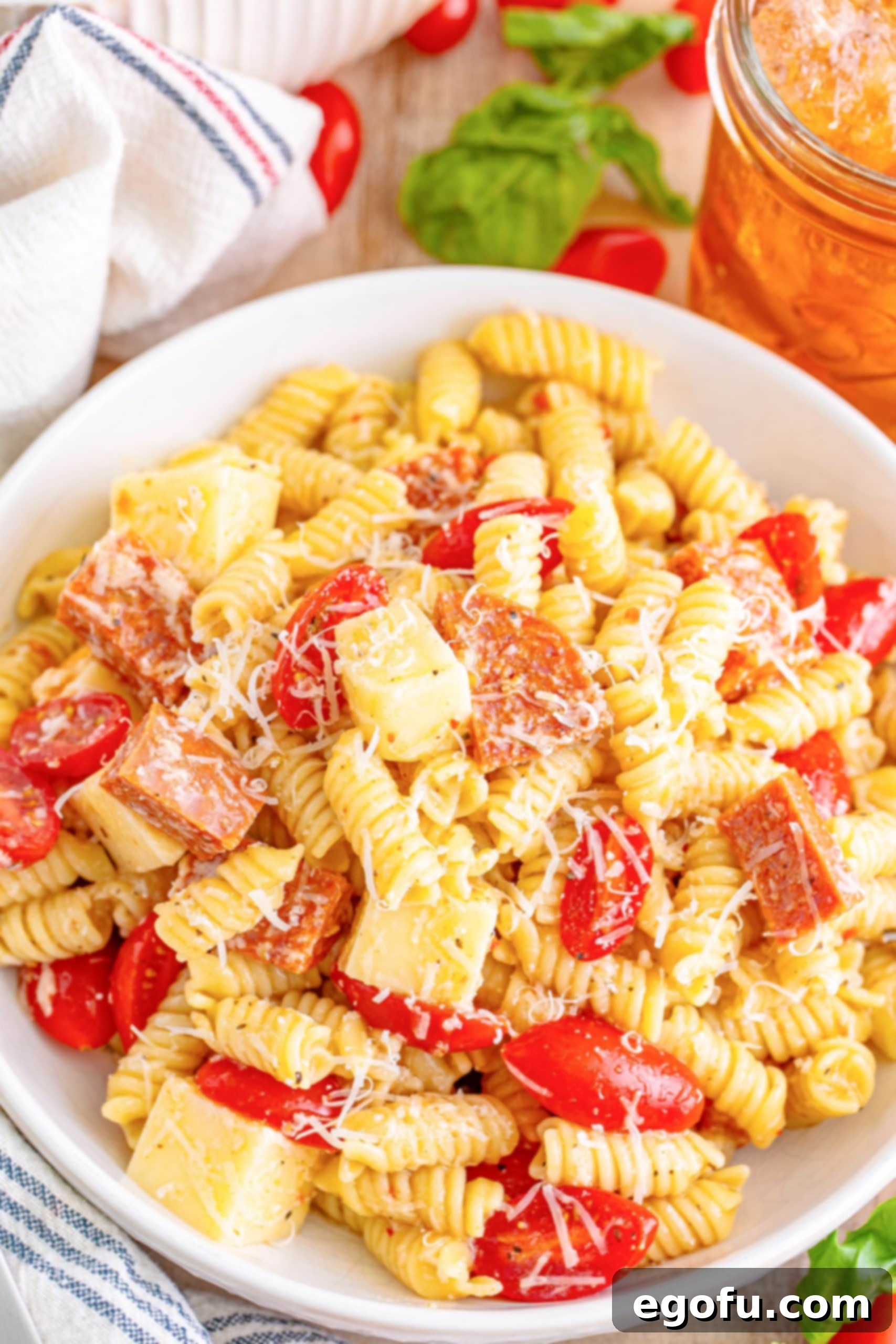 A large white bowl full of Pepperoni Pizza Pasta Salad. 