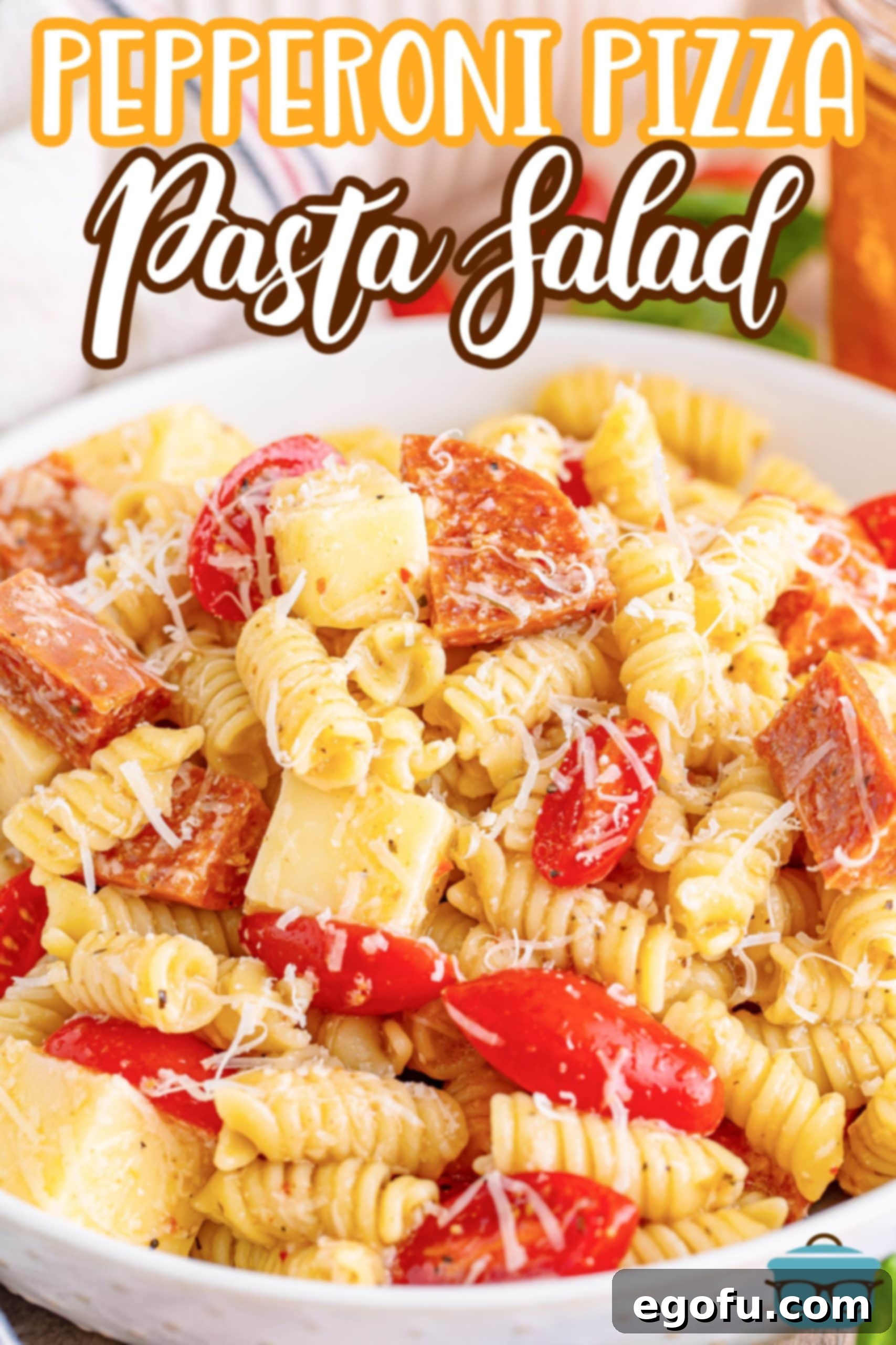 Close up looking at a serving bowl of Pepperoni Pizza Pasta Salad. 