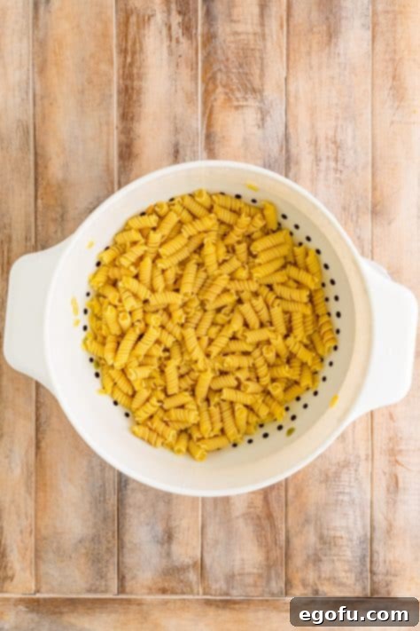 A strainer of cooked pasta.