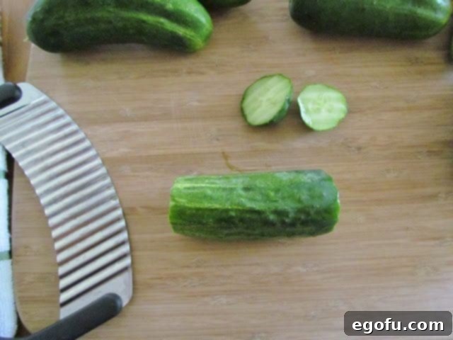 Sweet & Tangy Golden Slices 8 Freshly sliced pickling cucumbers neatly arranged on a cutting board, poised for the next step in the brining process.