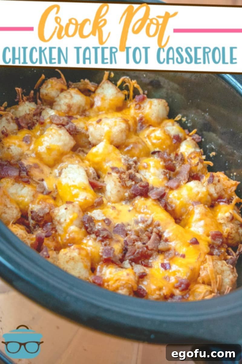 The finished Crock Pot Chicken Tater Tot Casserole, golden and bubbly, served directly from a black oval slow cooker, ready to be enjoyed.