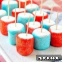 Patriotic Jell-O Marshmallows with toothpicks on a plate