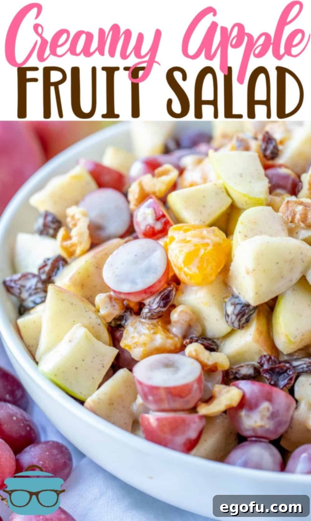 Creamy Cinnamon Apple Fruit Salad shown close up in a large white shallow bowl.