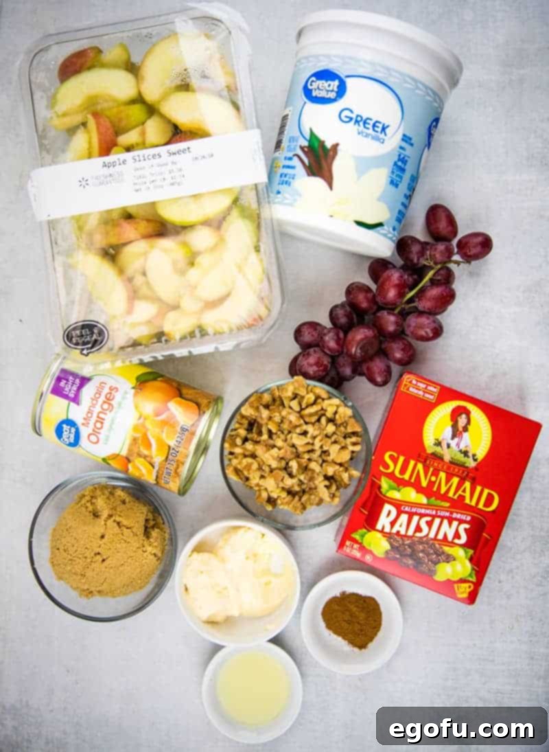 diced apples, raisins, grapes, Greek yogurt, brown sugar, cinnamon, mandarin oranges, walnuts and mayonnaise.