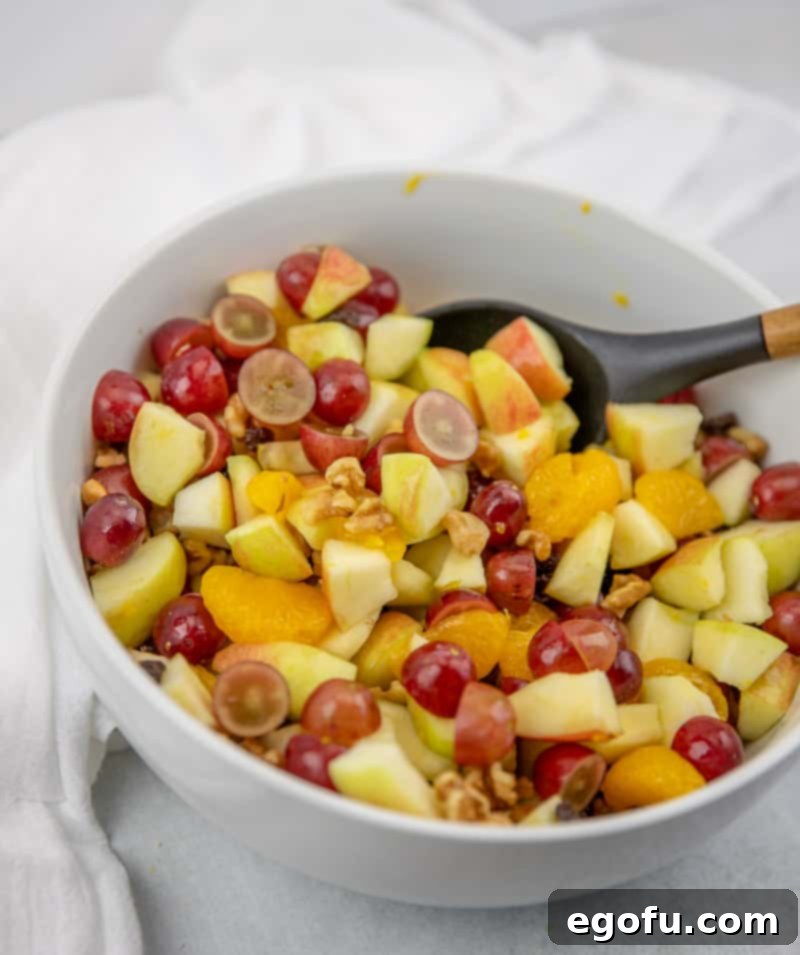 sliced fruit salad ingredients in a large bowl.